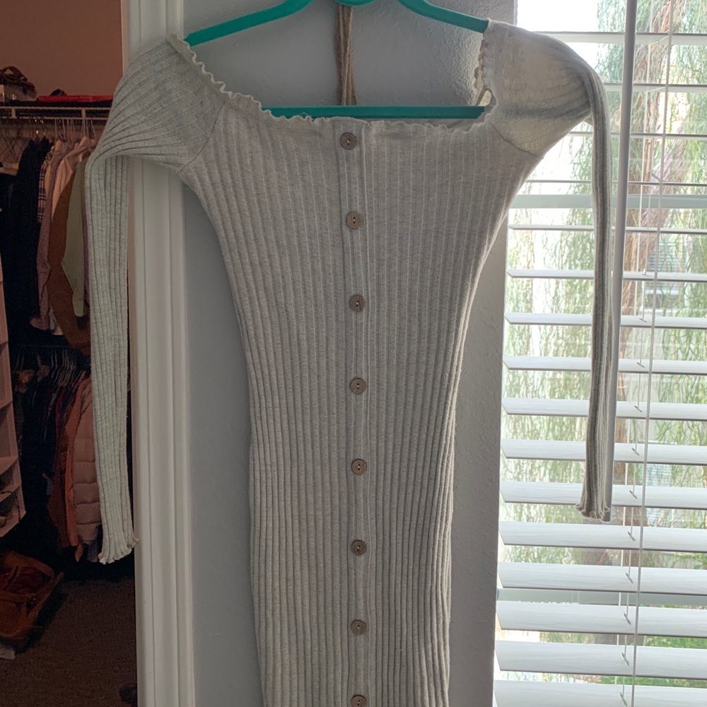 This is a gray beige fitted dress.